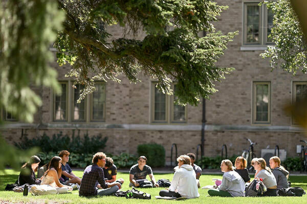 American Studies professor Korey Garibaldi teaches his University Seminar course outside on a late summer day in the fall semester 2023