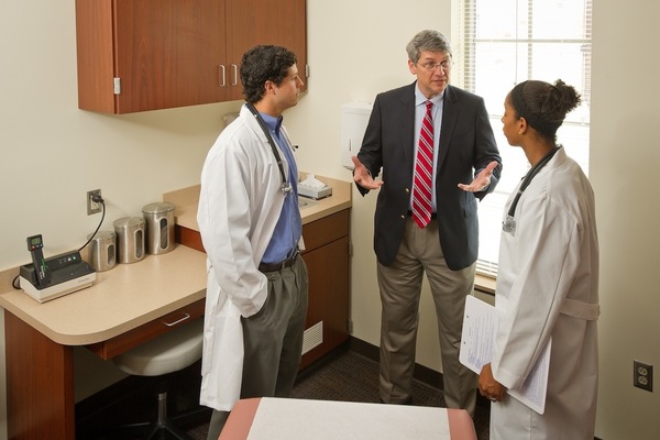 Dr. Dominic Vachon works with undergraduate pre-med majors on doctor-patient interaction